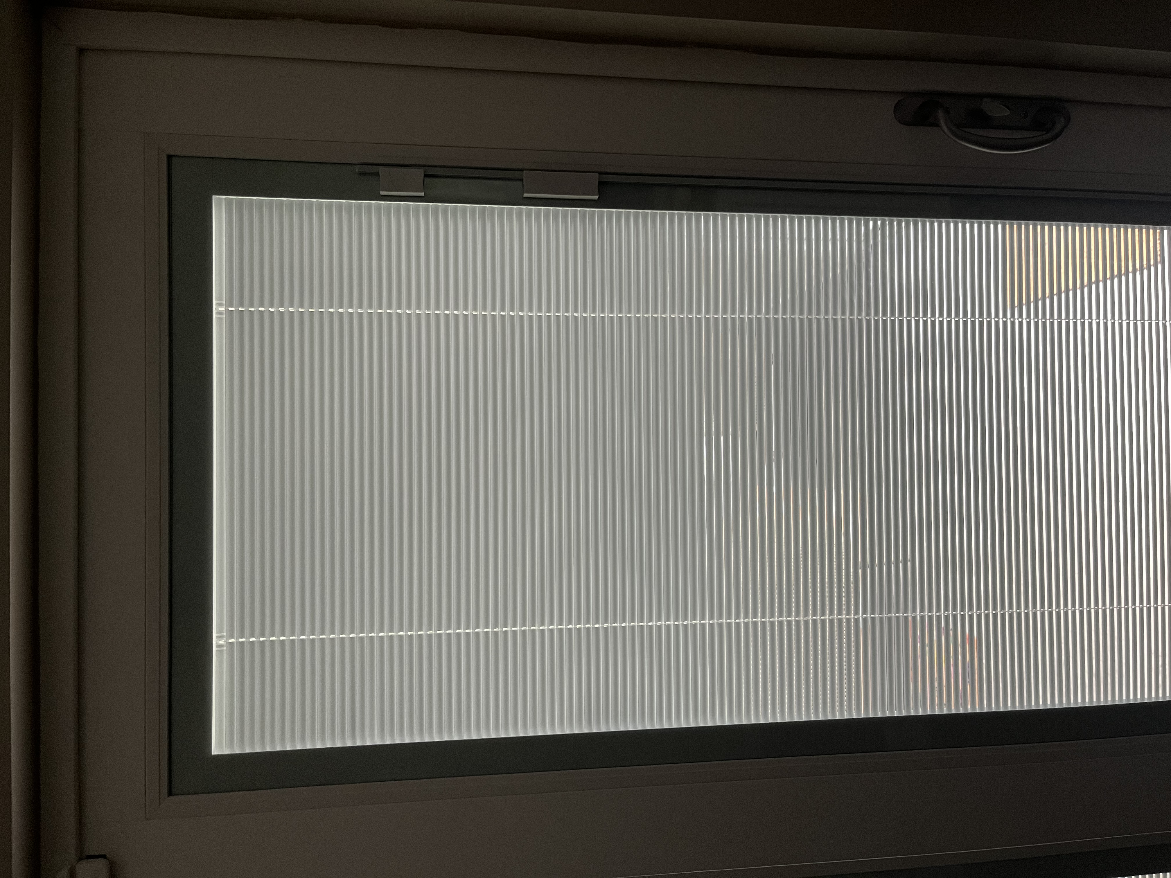 The sunroom door blinds at the correct tilt